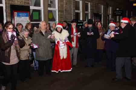 Carol singing on Hebden Bridge Station in 2012